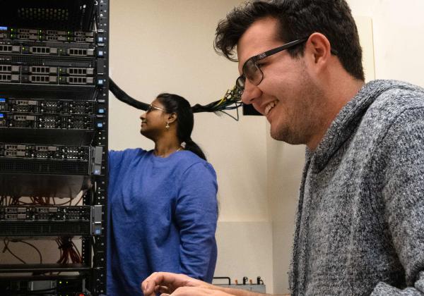 Computer System Technology students working on a computer